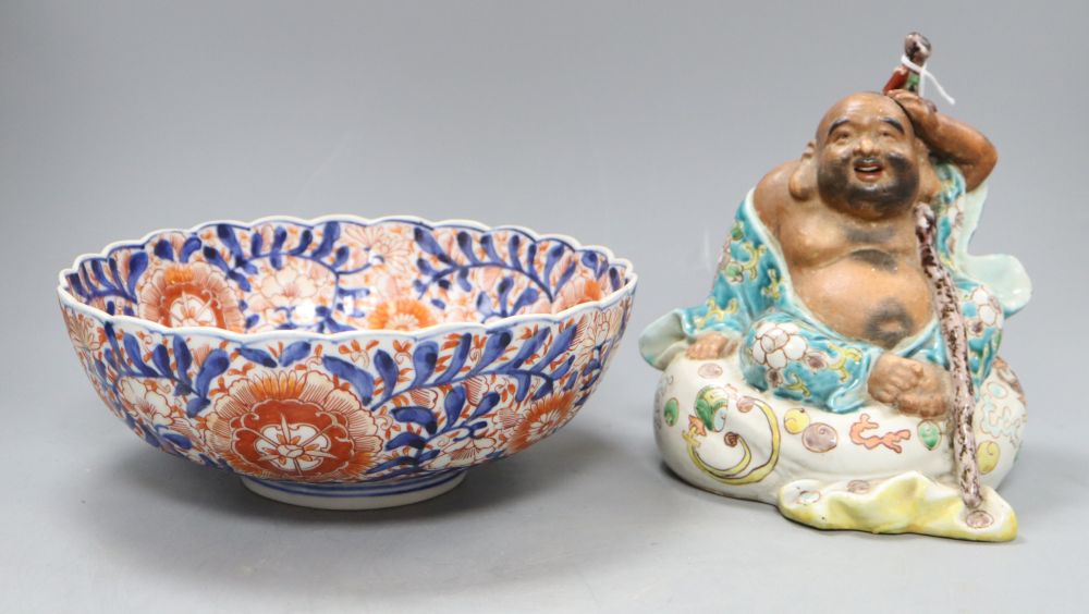 A Japanese kutani figure of Hotei and an Imari bowl, figure H.19cm